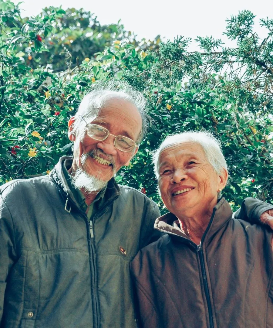 A smiling older couple outdoors