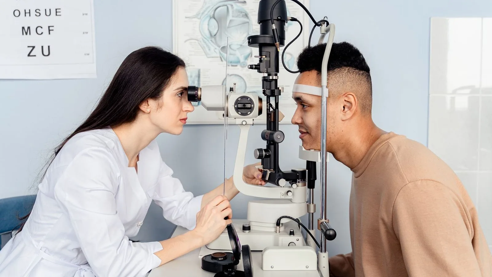 A patient at a slit lamp during an eye exam
